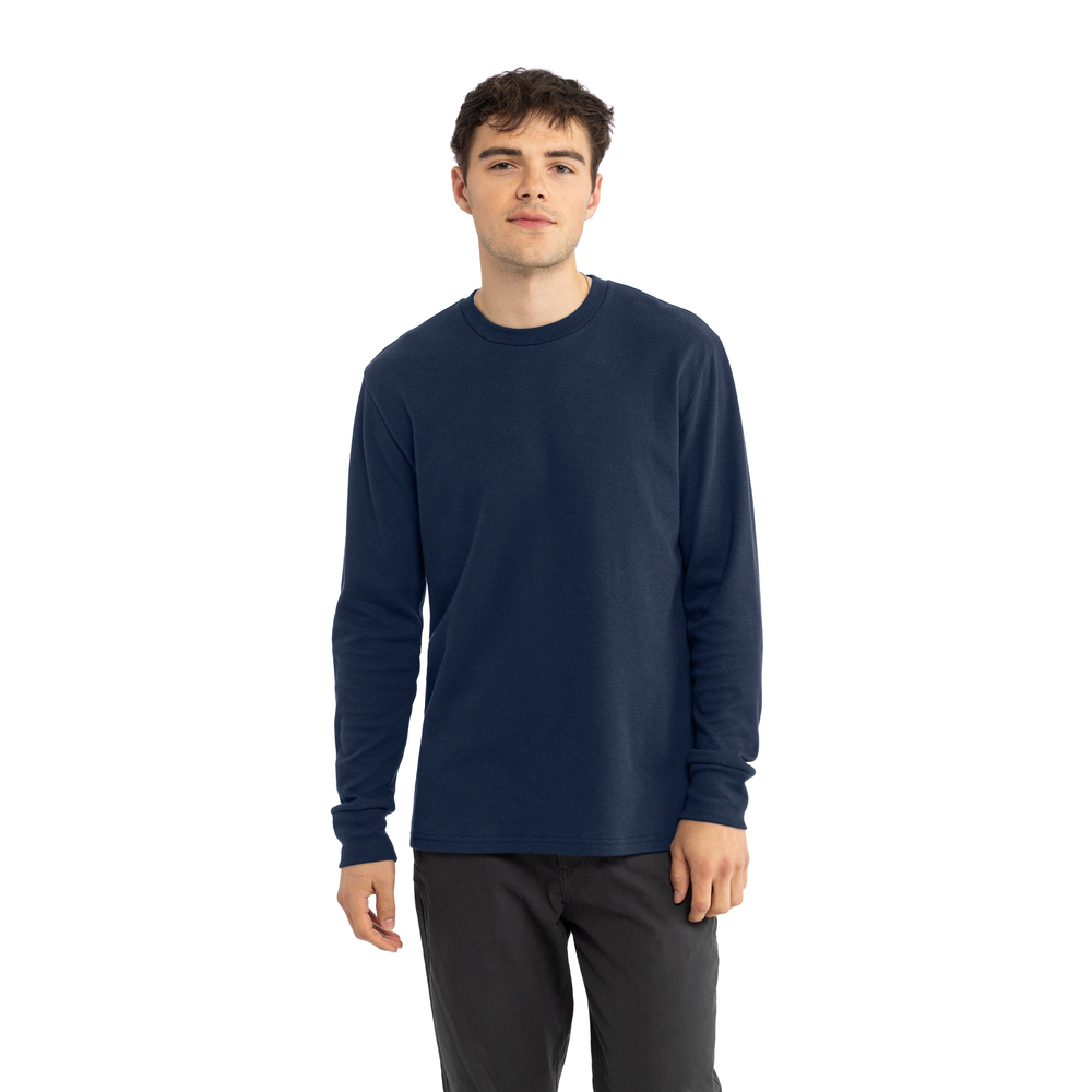 Man wearing a navy long-sleeve shirt on a white background